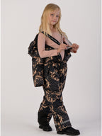 Luxury girls’ snowsuit with golden baroque print on black, handcrafted in Europe from waterproof polyester with Sorona® plant-based insulation. Warm and breathable winter overall for kids, certified Oeko-Tex Standard 100, perfect for skiing and cold weather up to −25°C.