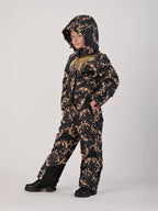 Luxury girls’ snowsuit with golden baroque print on black, handcrafted in Europe from waterproof polyester with Sorona® plant-based insulation. Warm and breathable winter overall for kids, certified Oeko-Tex Standard 100, perfect for skiing and cold weather up to −25°C.