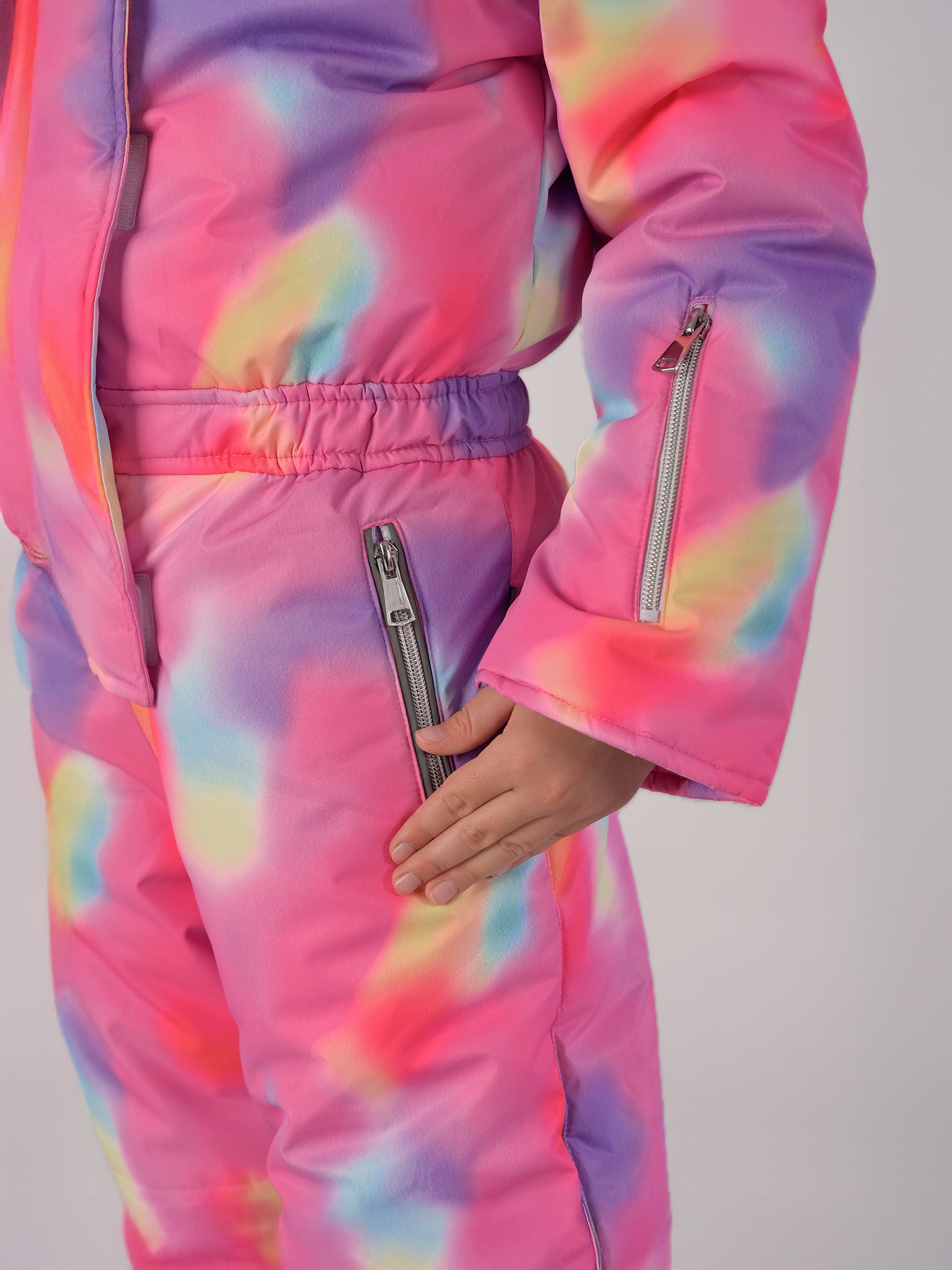 Luxury kids’ snowsuit with pastel watercolor print, waterproof and breathable, Sorona® eco insulation, Oeko-Tex certified, handcrafted in Europe for warmth down to −25°C.