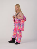 Luxury kids’ snowsuit with pastel watercolor print, waterproof and breathable, Sorona® eco insulation, Oeko-Tex certified, handcrafted in Europe for warmth down to −25°C.